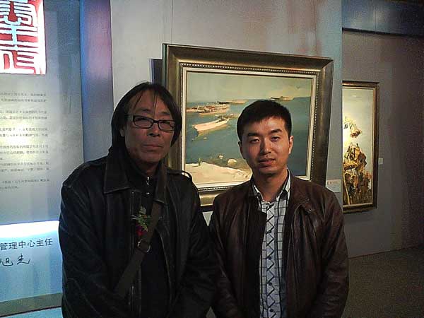 中国美术家协会会员、中国油画学会会员白羽平与《艺术天成》杂志社市场部经理林少云合影